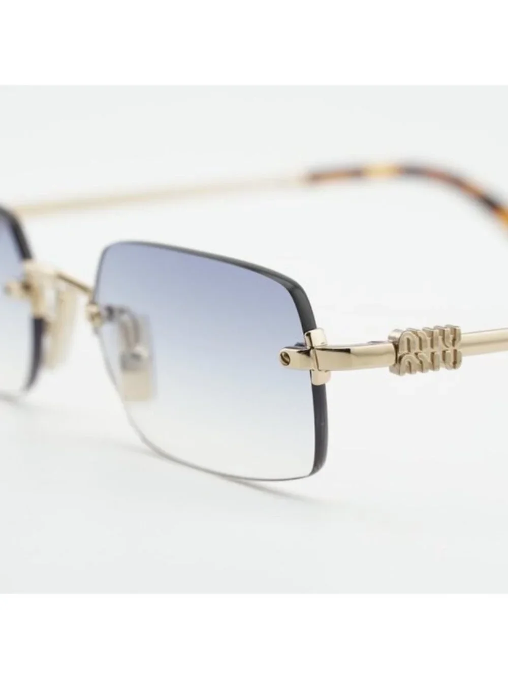Miu Miu MUB50S ZVN80O Sunglasses Gold Rectangle Frame, Light Blue Lenses